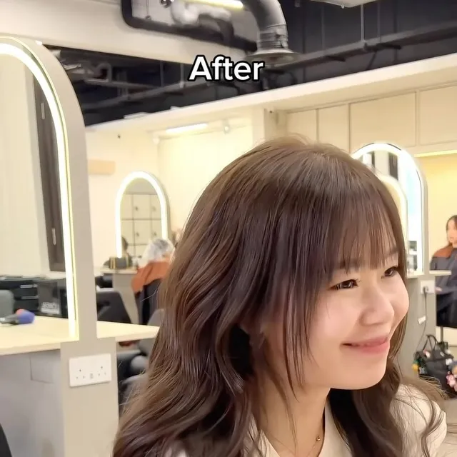Warm brown waves with a face-framing cut
